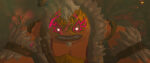 A goron from Tears of the Kingdom grimaces as if ready for a fight. His face his painted in electric red designs that seem to glow.