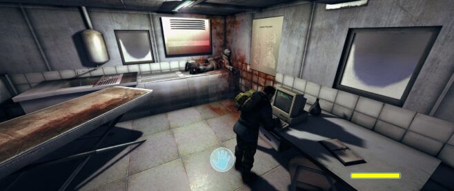 A screenshot from The Thing Remastered with the camera looking into a medical lab with a corpse in the corner and someone working on a computer