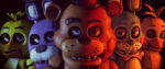 A close-up shot of the main animatronic animals from Five Nights at Freddy's, all of them creepily grinning.