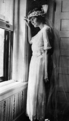 Hadley Richardson in her wedding dress looking out the window on her wedding day in Horton Bay, MI, 3 September 1921. Credit: "Ernest Hemingway Collection/John F. Kennedy Presidential Library and Museum, Boston."