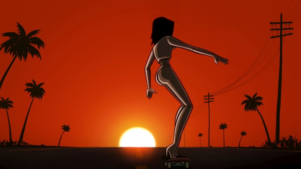 Layla rides her skateboard as the sun sets behind her, palm trees and telephone poles standing in silhouette against the red-orange sky.