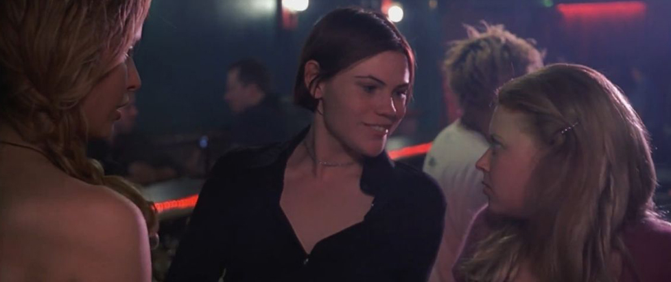 Clea Duvall and Natasha Lyonne gaze at each other in a dance club in this still from But I’m a Cheerleader!.