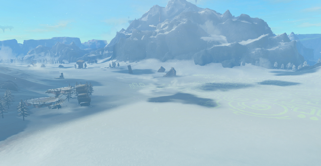 The icy shores of a lake are nestled in a snowy valley in this screenshot from Tears of the Kingdom.