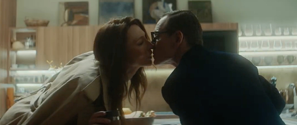 Michael Fassbender and Cate Blanchett lean in for a kiss in a scene from Black Bag.