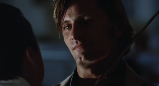 A screenshot from the trailer of American Yakuza where Viggo is standing with a sword at his neck but he don't look bothered