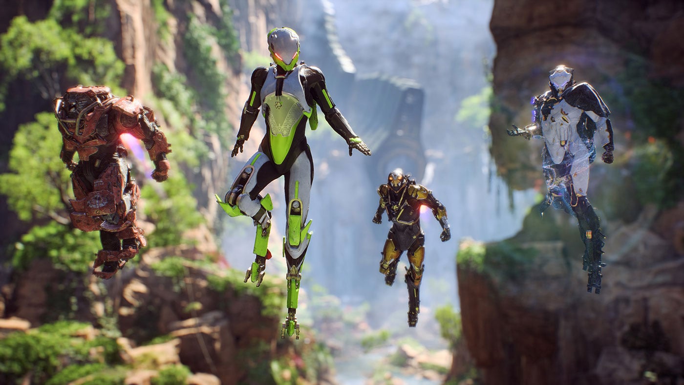 Four armored Javelin exosuits flying above a lush, jungle environment.