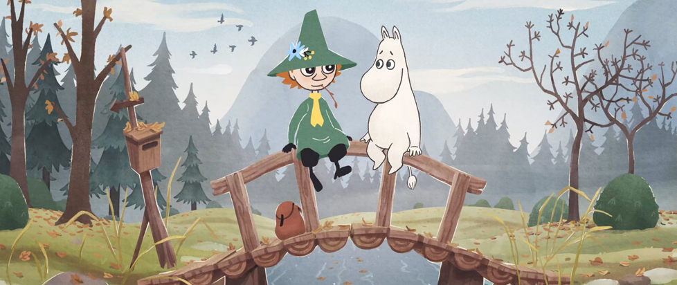An illustration of two characters, Snufkin and Moomintroll, sitting on a small wooden bridge in a natural, autumnal setting.