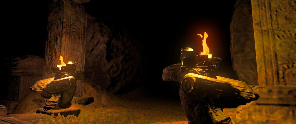 A dark, ancient ruin is dimly lit by two stone torch stands. The torches, shaped like animal heads or totems, have bright orange flames.