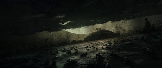 A screenshot from Alien Covenant featuring the progenitors home planet getting swarmed with the black goo that transforms creatures into xenomorphs