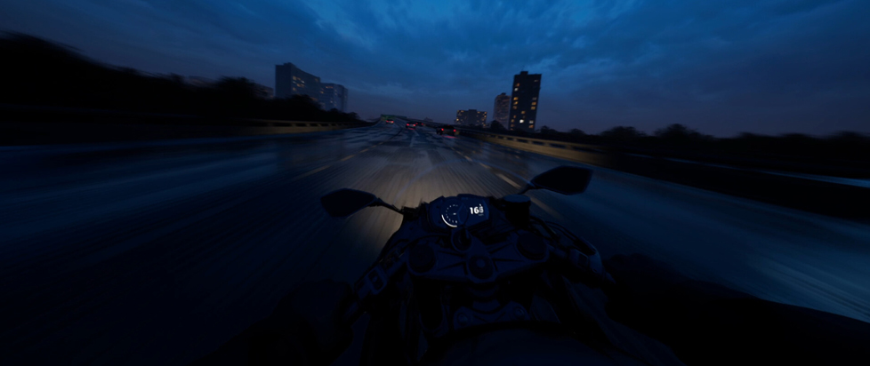 A screenshot from Lanesplit shows a first-person perspective of a motorcycle ride on a highway at night.