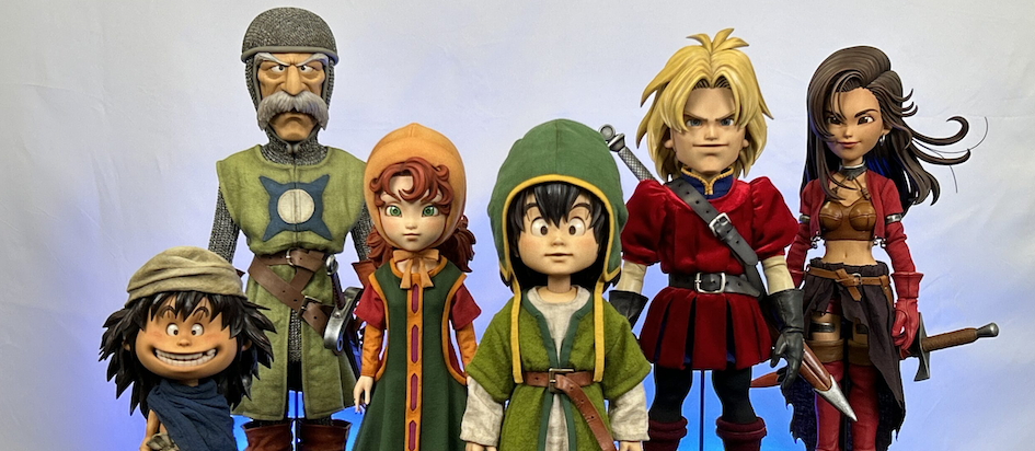A photograph of painted miniatures of the characters from Dragon Quest VII all looking dazed and doll like