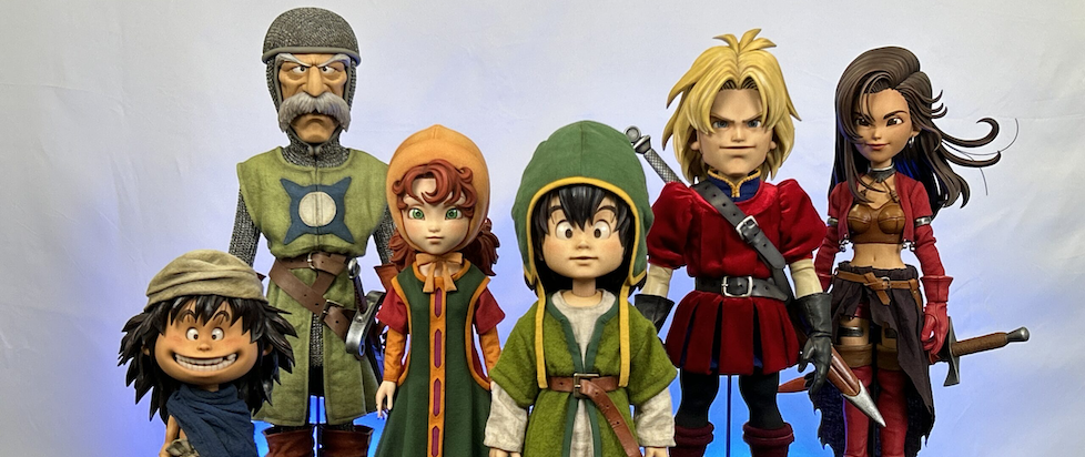 A photograph of painted miniatures of the characters from Dragon Quest VII all looking dazed and doll like
