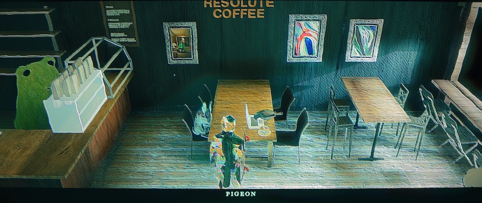 a screenshot from Skate Story where the glassy skater is in a coffee shop where a Piegon is pecking away at a laptop