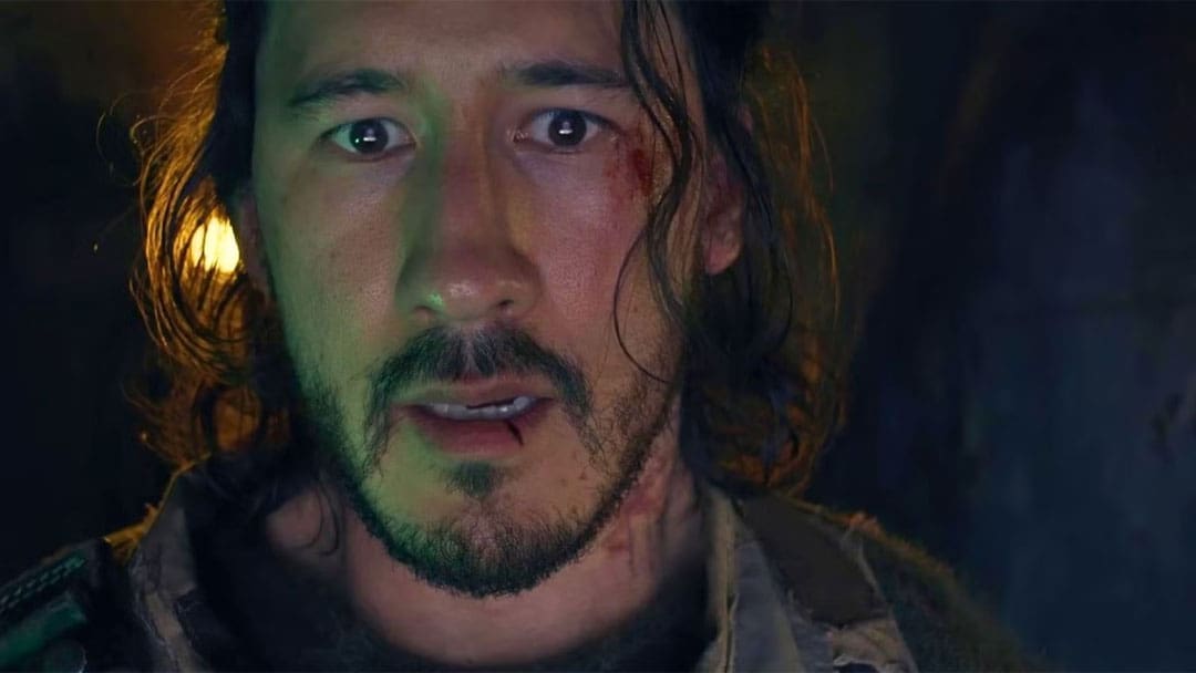 A close-up of YouTuber and actor Markiplier in a scene from his self-directed horror movie Iron Lung.