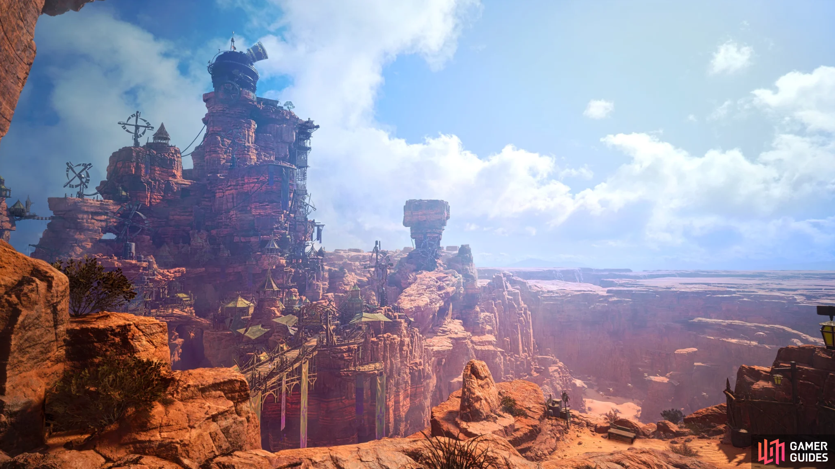 A wide-angle view of Cosmo Canyon from Final Fantasy VII Rebirth. A massive, multi-tiered rock plateau features a complex settlement built directly into the red sandstone cliffs.