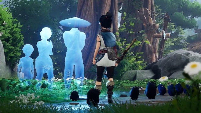 A screenshot from Kena Bridge of Souls with the young warrior standing before three blue spirits and their stones while they put their hands together in thanks