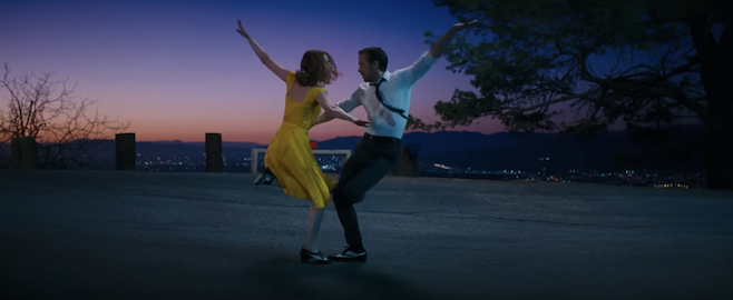 A screenshot from La La Land where two characters are dancing at sunset at a park overlooking Los Angeles
