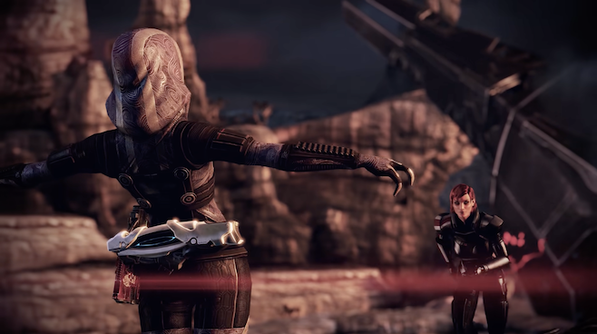 A screenshot from Mass Effect where Tali has her arms out and is falling backwards but Jane Shepard is rushing towards her rescue